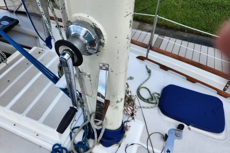 Slide: The Image of Deck of 1990 Morgan 44 Center Cockpit sailboat with winch and ropes. - 19