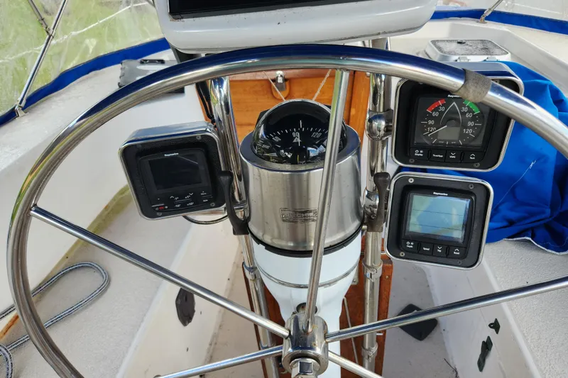 Slide: The Image of Cockpit of 1990 Catalina/Morgan 44 Center with navigation instruments and steering wheel. - 20