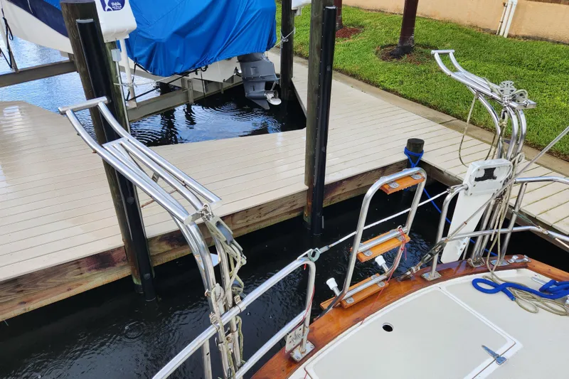 Slide: The Image of Sailboat docked at marina, Catalina/Morgan 44 Center Cockpit, 1990 model, with stainless steel fittings. - 5