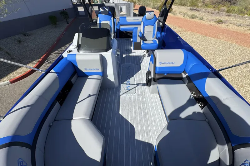 Slide: The Image of Interior of 2025 Paradigm 27SST boat with blue and gray seating. - 18