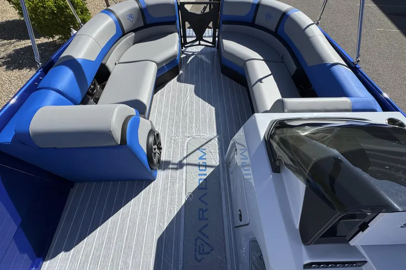 Slide: The Image of 2025 Paradigm 27SST boat interior with blue and gray seating, modern design. - 5