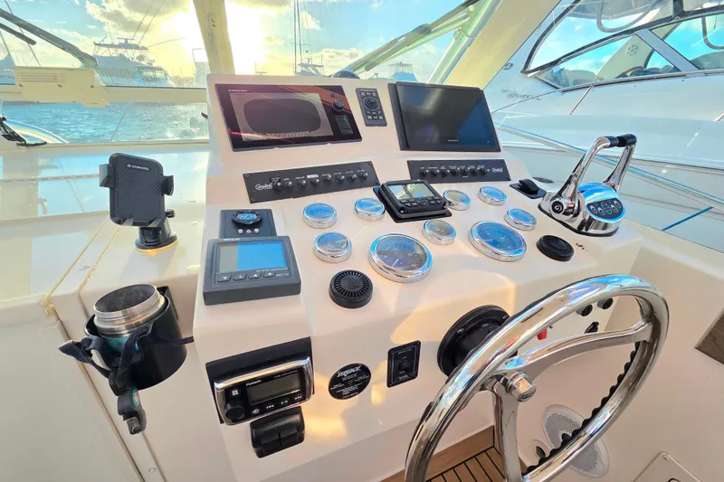 Slide: The Image of Helm of 2007 Carolina Classic 28 Express with modern navigation instruments and controls. - 11