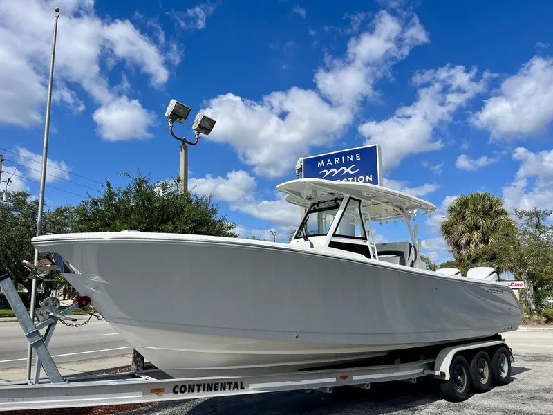 Slide: The Image of Cobia 305 Center Console 2026 - 2