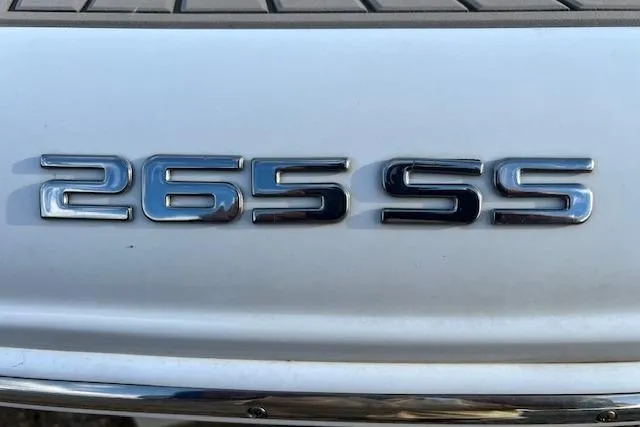 Slide: The Image of Chrome "265 SS" emblem on a 2021 Crownline boat. - 23