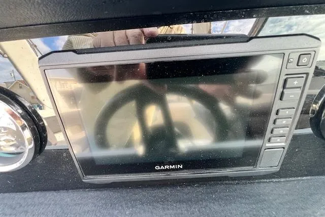 Slide: The Image of Garmin display on 2021 Crownline 265 SS boat dashboard, reflecting steering wheel. - 5