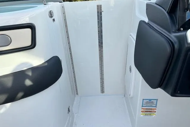 Slide: The Image of Interior view of 2021 Crownline 265 SS boat, featuring sleek white and black design. - 7
