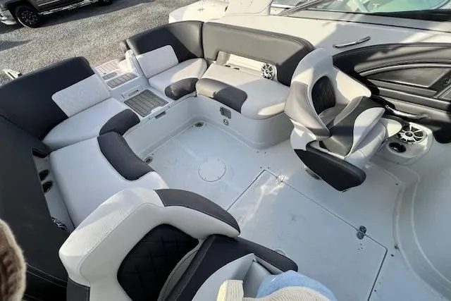 Slide: The Image of 2021 Crownline 265 SS boat interior with stylish seating and modern design. - 8