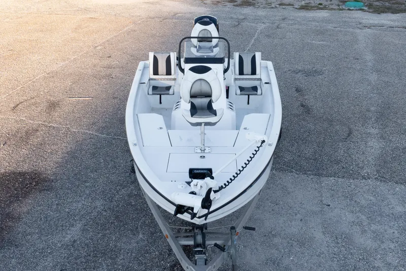 Slide: The Image of 2020 Vexus AVX1980CC boat on pavement, featuring sleek design and modern seating. - 10