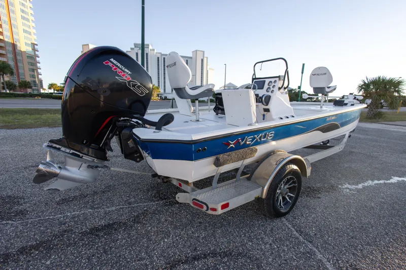 Slide: The Image of 2020 Vexus AVX1980CC boat with Mercury Pro XS engine, parked on a trailer. - 11