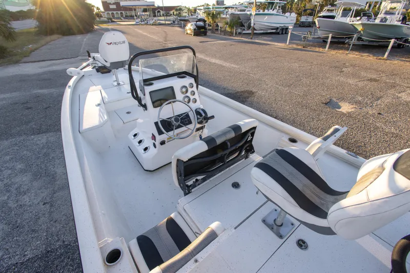 Slide: The Image of 2020 Vexus AVX1980CC boat interior with steering console and seating. - 14