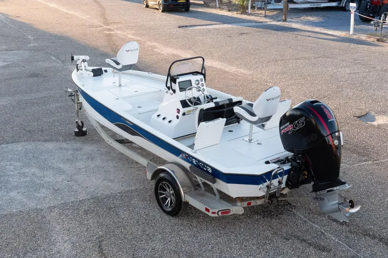 Slide: The Image of 2020 Vexus AVX1980CC boat on trailer, featuring dual seats and powerful outboard motor. - 19