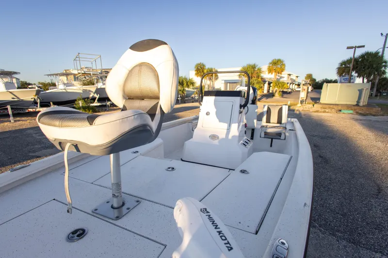 Slide: The Image of 2020 Vexus AVX1980CC boat with seating and console, parked outdoors. - 26