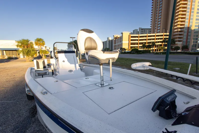 Slide: The Image of 2020 Vexus AVX1980CC boat parked near buildings and palm trees. - 27