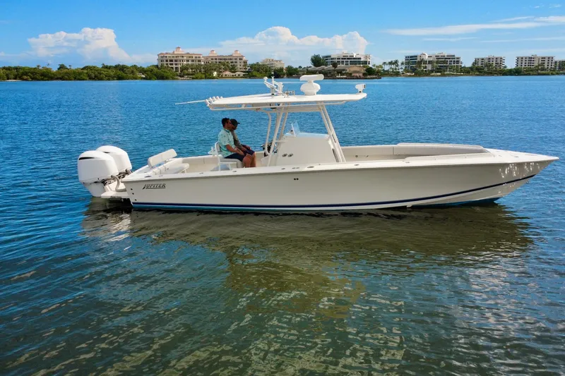 Slide: The Image of 2006 Jupiter 31FS boat on calm water with scenic background. - 1