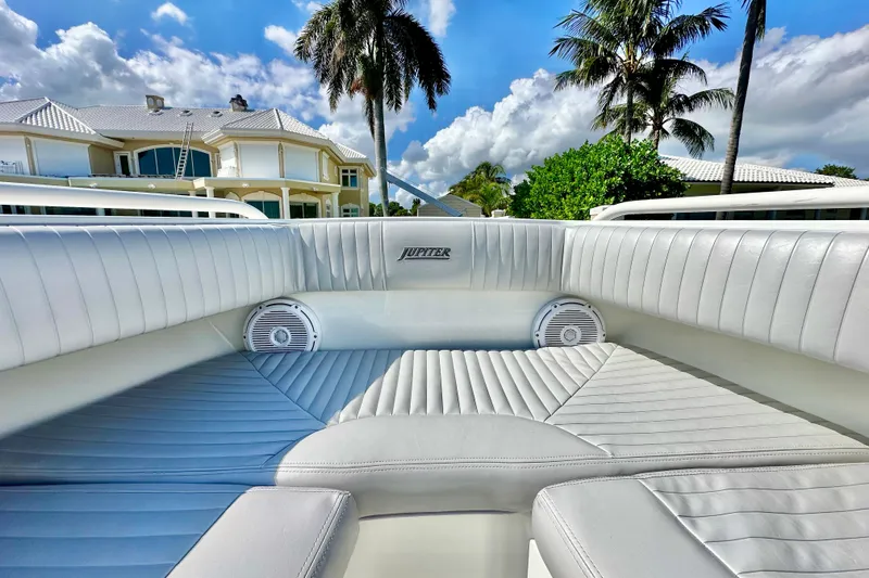 Slide: The Image of Luxurious interior of a 2006 Jupiter 31FS boat with plush seating and speakers. - 22