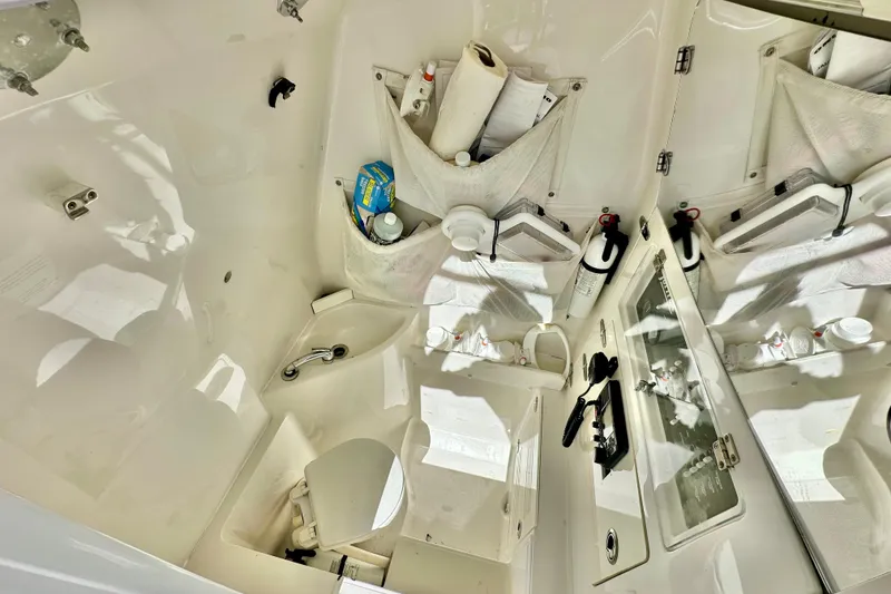 Slide: The Image of 2006 Jupiter 31FS boat interior with storage compartments and safety equipment. - 43