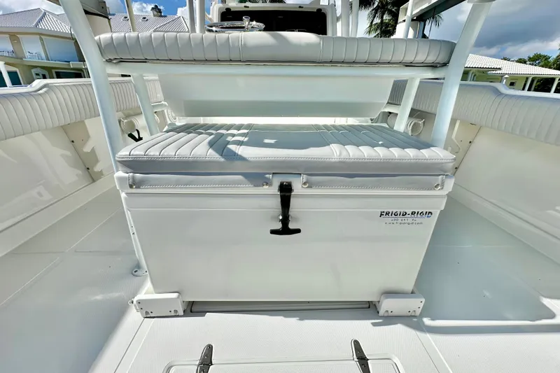 Slide: The Image of 2006 Jupiter 31FS boat interior with Frigid Rigid cooler and cushioned seating. - 57