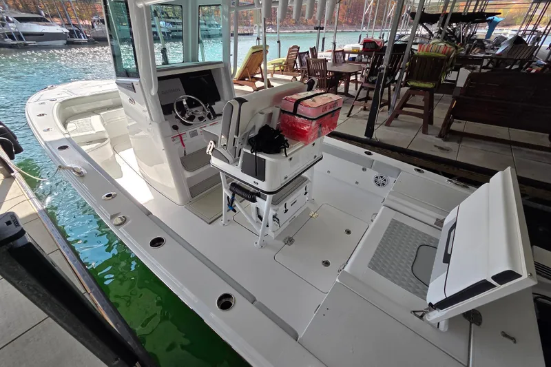 Slide: The Image of 2026 Blackfin 262 HB boat docked, featuring a sleek design and modern controls. - 11