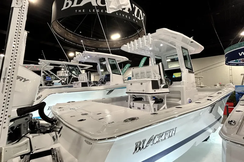 Slide: The Image of 2026 Blackfin 262 HB boat displayed at an indoor boat show. - 13
