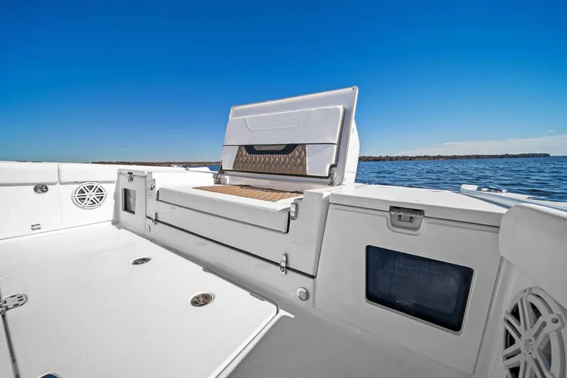 Slide: The Image of Manufacturer Provided Image: 2026 Blackfin 262 HB boat interior with seating, white deck, and ocean view. - 6