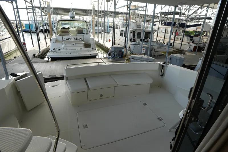 Slide: The Image of 2004 Carver 560 Voyager yacht docked in marina, view from deck. - 14