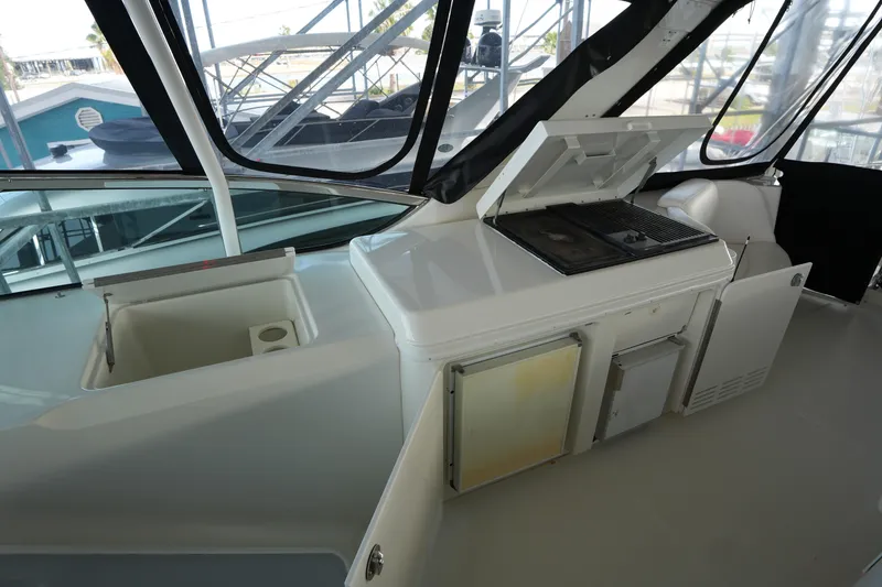 Slide: The Image of 2004 Carver 560 Voyager yacht interior with kitchenette and grill area. - 19