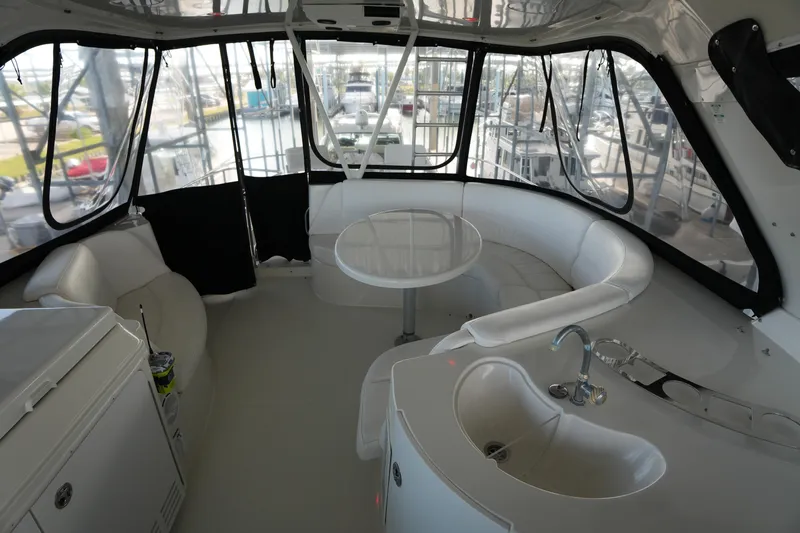 Slide: The Image of Interior of 2004 Carver 560 Voyager yacht with seating and kitchenette. - 20