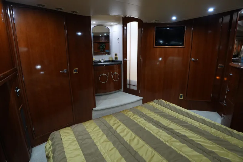 Slide: The Image of Luxurious interior of 2004 Carver 560 Voyager yacht with wood paneling and modern amenities. - 43