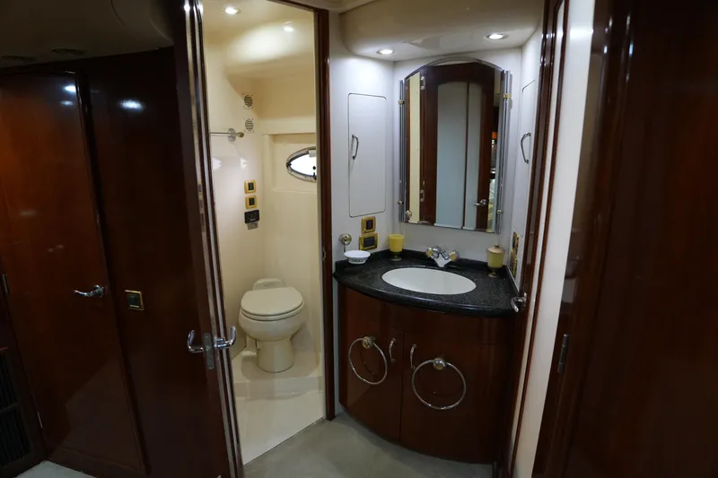 Slide: The Image of Luxurious bathroom in 2004 Carver 560 Voyager yacht with elegant wood finishes. - 44