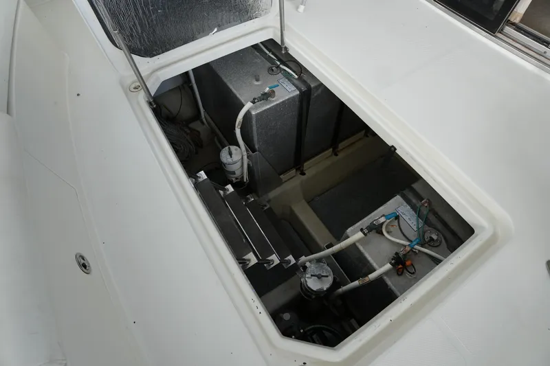Slide: The Image of 2004 Carver 560 Voyager engine compartment with visible components and wiring. - 48