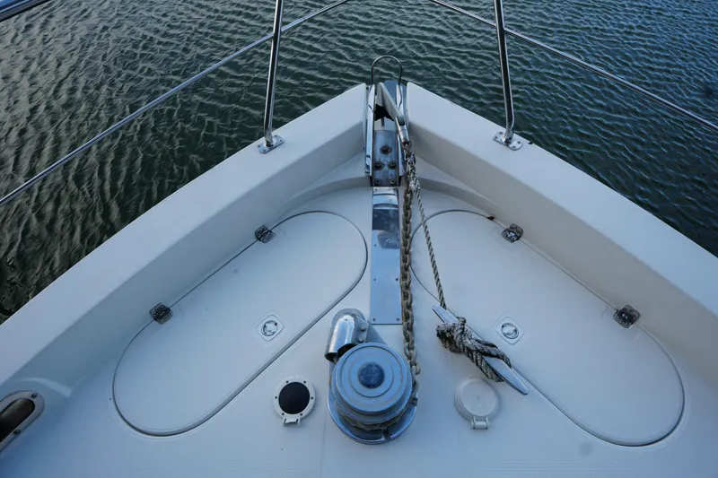 Slide: The Image of Bow of 2004 Carver 560 Voyager yacht with anchor and rope on deck. - 7