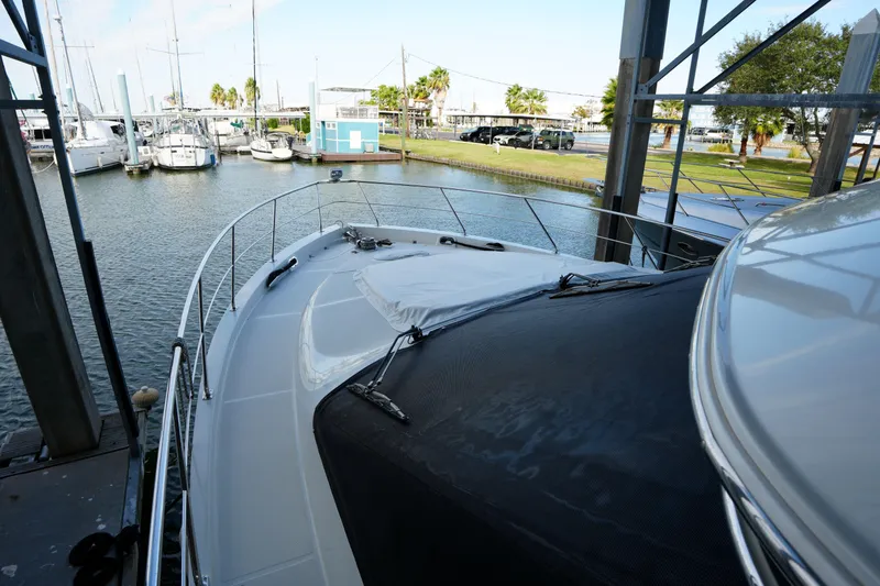 Slide: The Image of 2004 Carver 560 Voyager yacht docked at marina, view from bow. - 11
