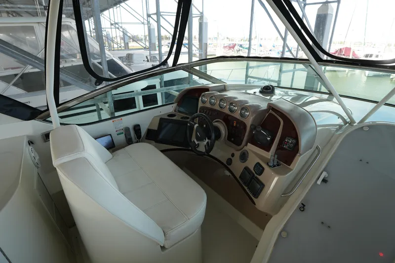 Slide: The Image of 2004 Carver 560 Voyager helm with modern controls and leather seating. - 17