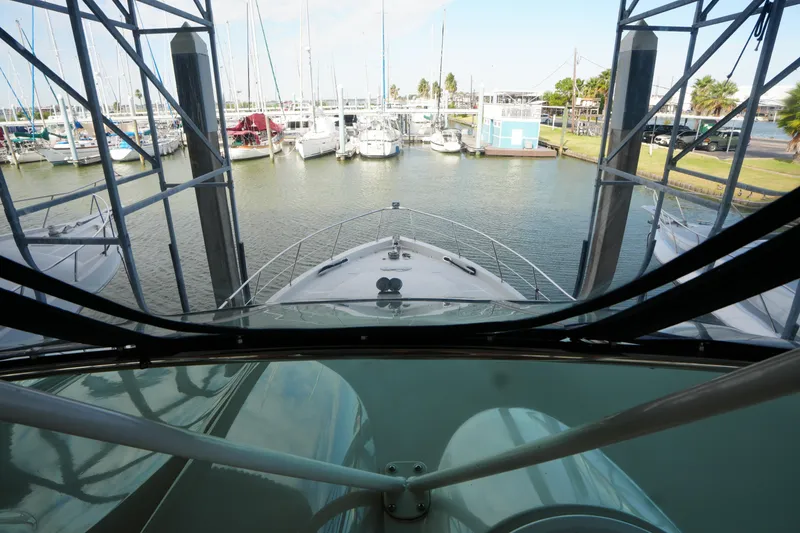 Slide: The Image of 2004 Carver 560 Voyager yacht docked at marina, view from helm. - 22