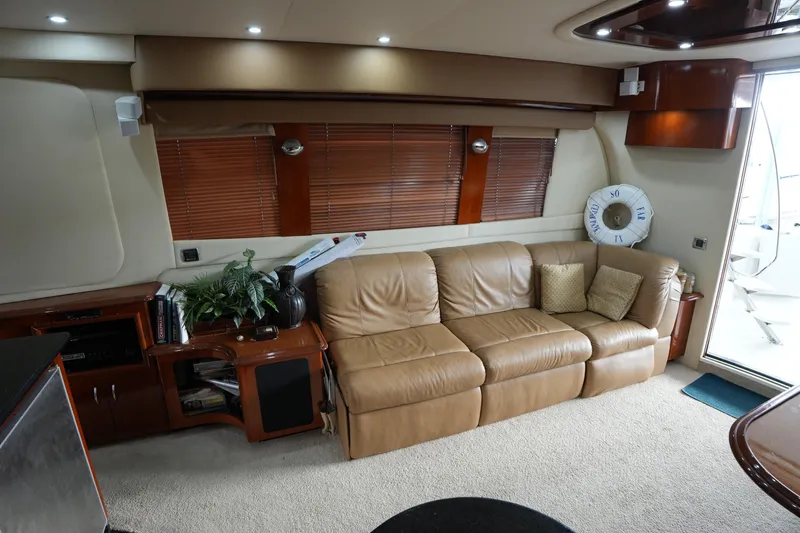 Slide: The Image of Luxurious interior of 2004 Carver 560 Voyager yacht with leather sofa and elegant decor. - 25