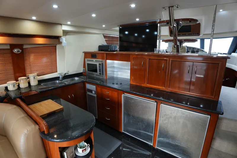 Slide: The Image of Luxurious kitchen interior of 2004 Carver 560 Voyager yacht with modern appliances. - 26