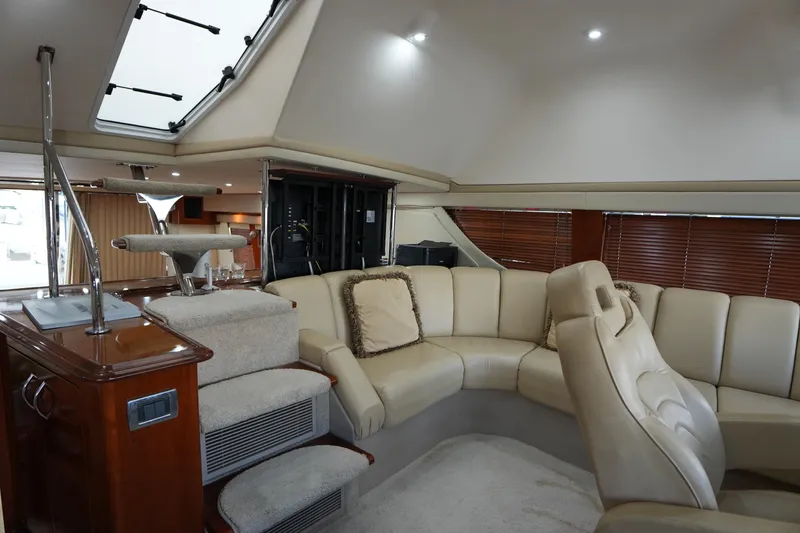 Slide: The Image of Luxurious interior of a 2004 Carver 560 Voyager yacht with plush seating and elegant design. - 29