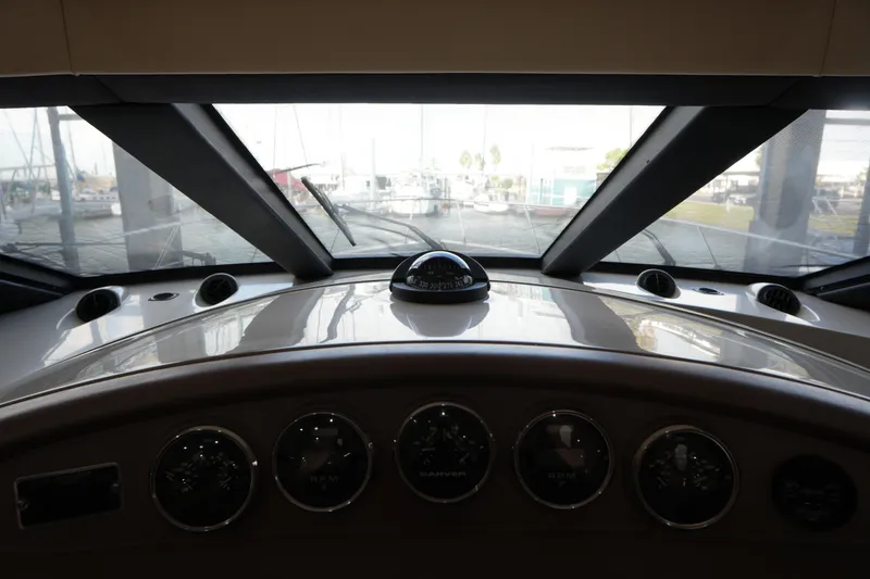 Slide: The Image of Interior view of 2004 Carver 560 Voyager yacht dashboard with gauges and compass. - 32
