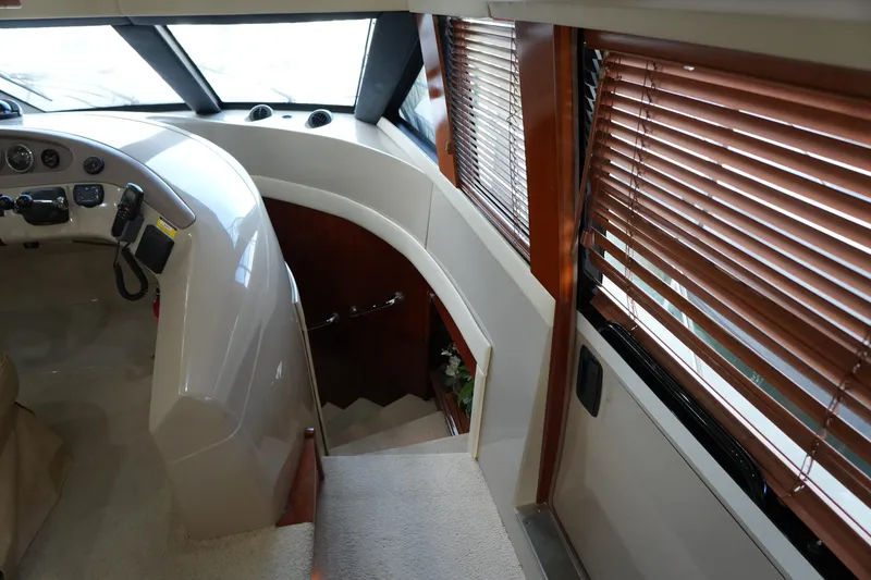 Slide: The Image of Interior of 2004 Carver 560 Voyager yacht with helm and wooden blinds. - 33