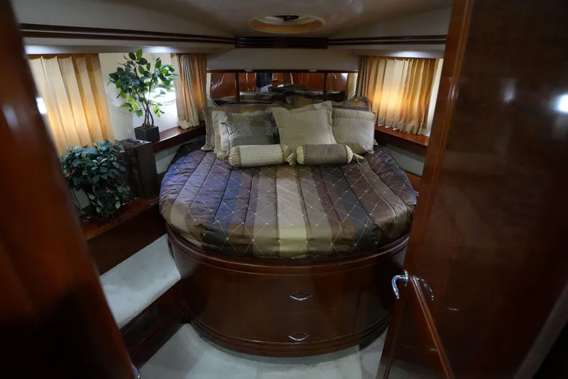Slide: The Image of Luxurious bedroom interior of 2004 Carver 560 Voyager yacht with elegant bedding and decor. - 35