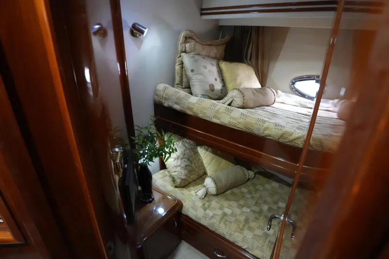 Slide: The Image of Luxurious cabin interior of 2004 Carver 560 Voyager yacht with cozy bunk beds. - 40