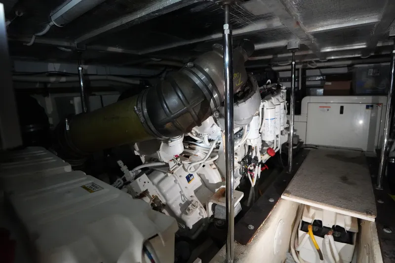 Slide: The Image of Engine room of a 2004 Carver 560 Voyager yacht, showcasing mechanical components. - 50
