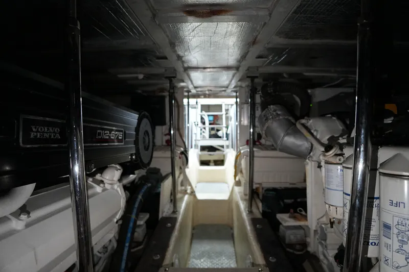 Slide: The Image of Engine room of 2004 Carver 560 Voyager with Volvo Penta D12-675 engines. - 53