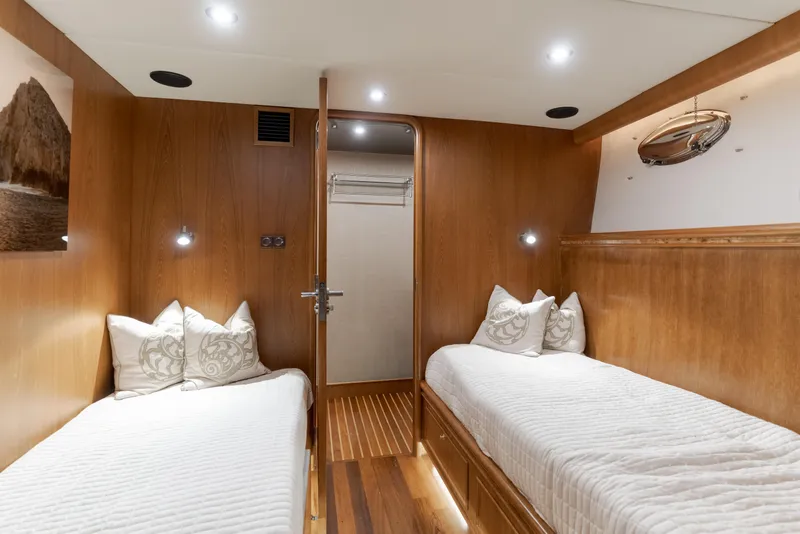 Slide: The Image of Luxurious 1997 Fobes Cooper Pilthouse cabin with twin beds and elegant wood paneling. - 20