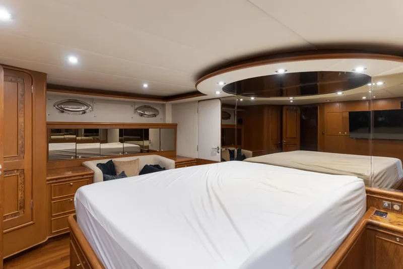 Slide: The Image of Luxurious 1997 Fobes Cooper Pilthouse yacht bedroom with elegant wood finishes and modern lighting. - 26