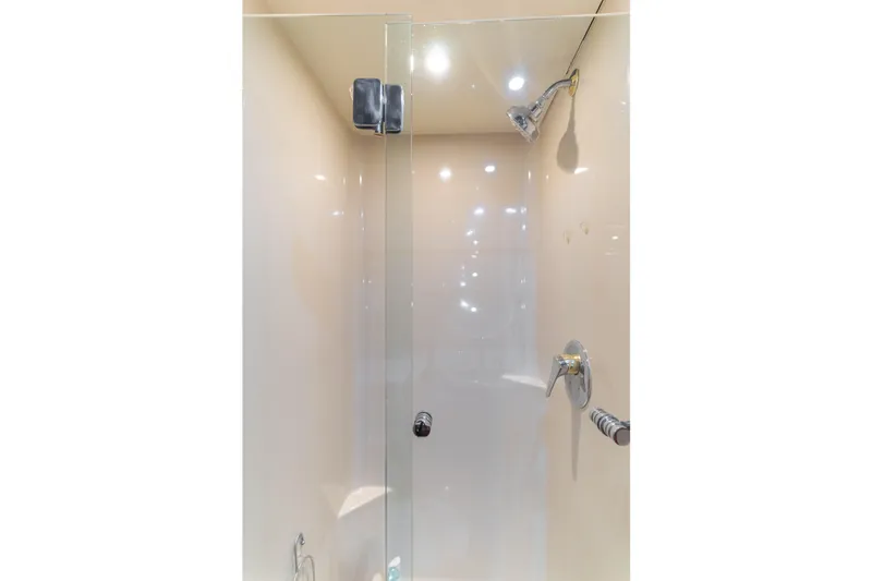 Slide: The Image of Shower area in 1997 Fobes Cooper Pilthouse with glass door and chrome fixtures. - 29
