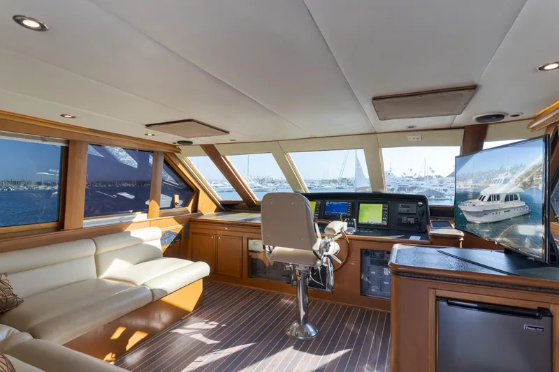 Slide: The Image of Luxurious 1997 Fobes Cooper Pilthouse yacht interior with helm, leather seating, and panoramic windows. - 33