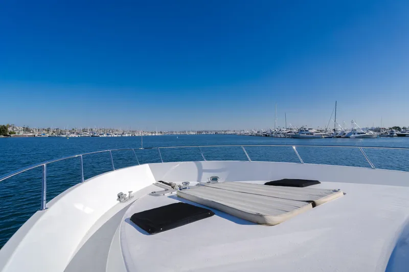 Slide: The Image of 1997 Fobes Cooper Pilthouse yacht deck with marina view under clear blue sky. - 38