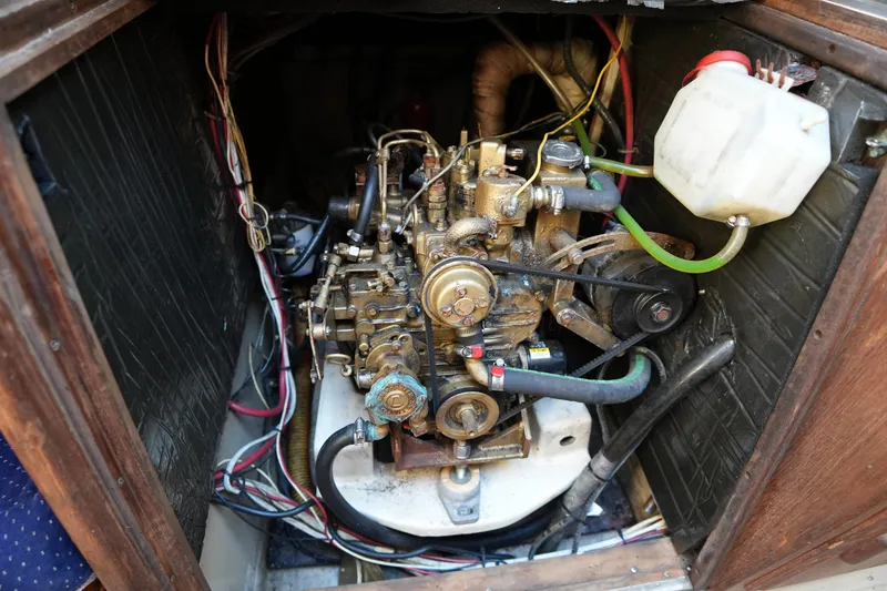 Slide: The Image of 1984 O'Day 30 sailboat engine compartment with visible wiring and components. - 15