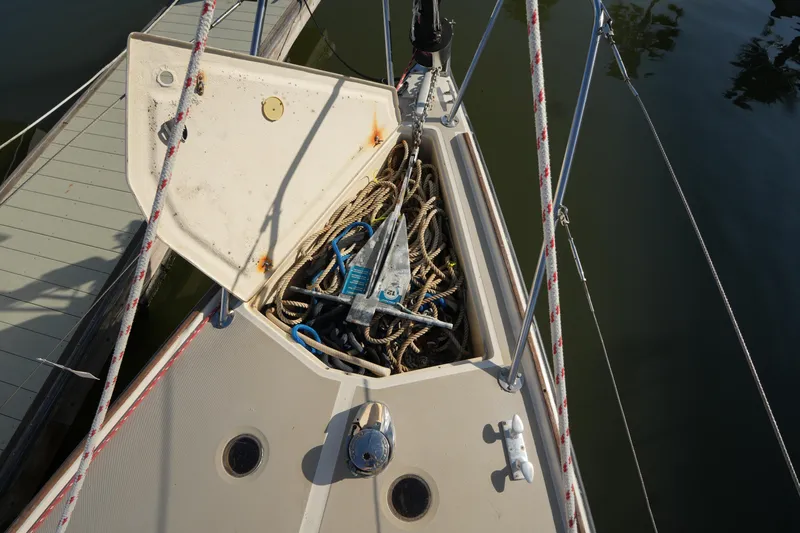 Slide: The Image of Anchor locker of 1984 O'Day 30 sailboat with ropes and anchor. - 3
